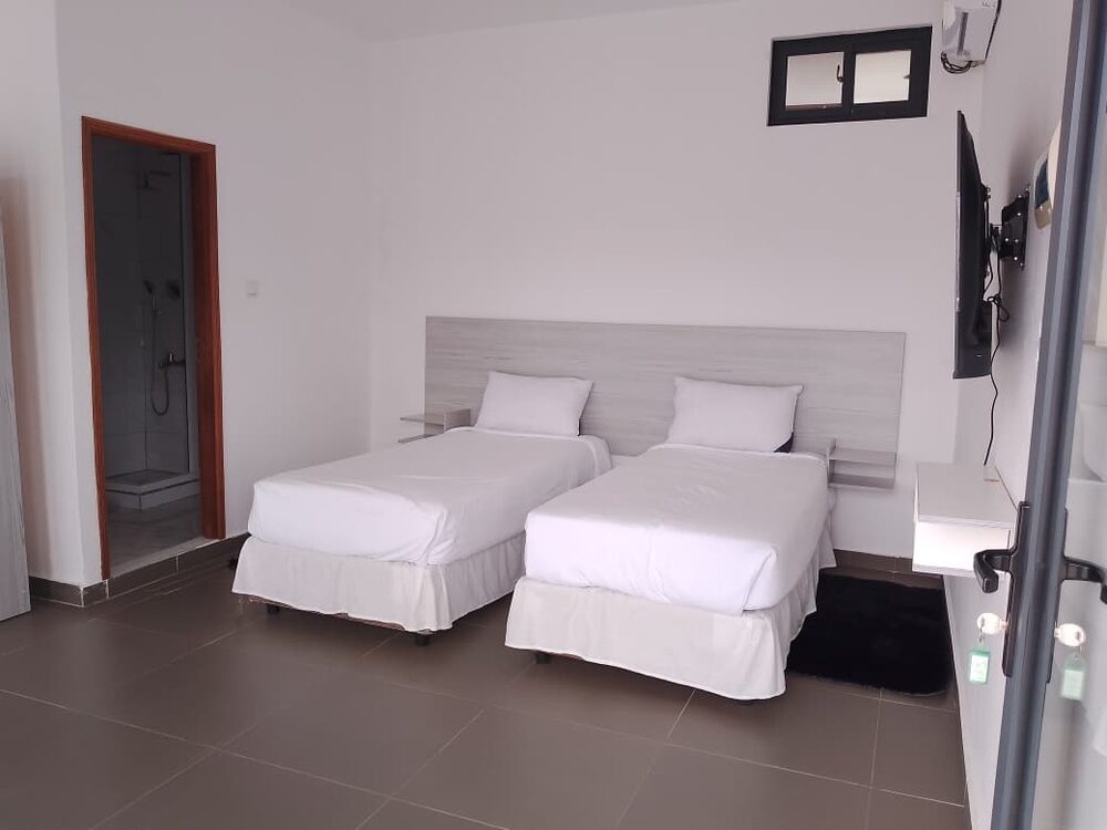 Quarto duplo com duas camas individuais